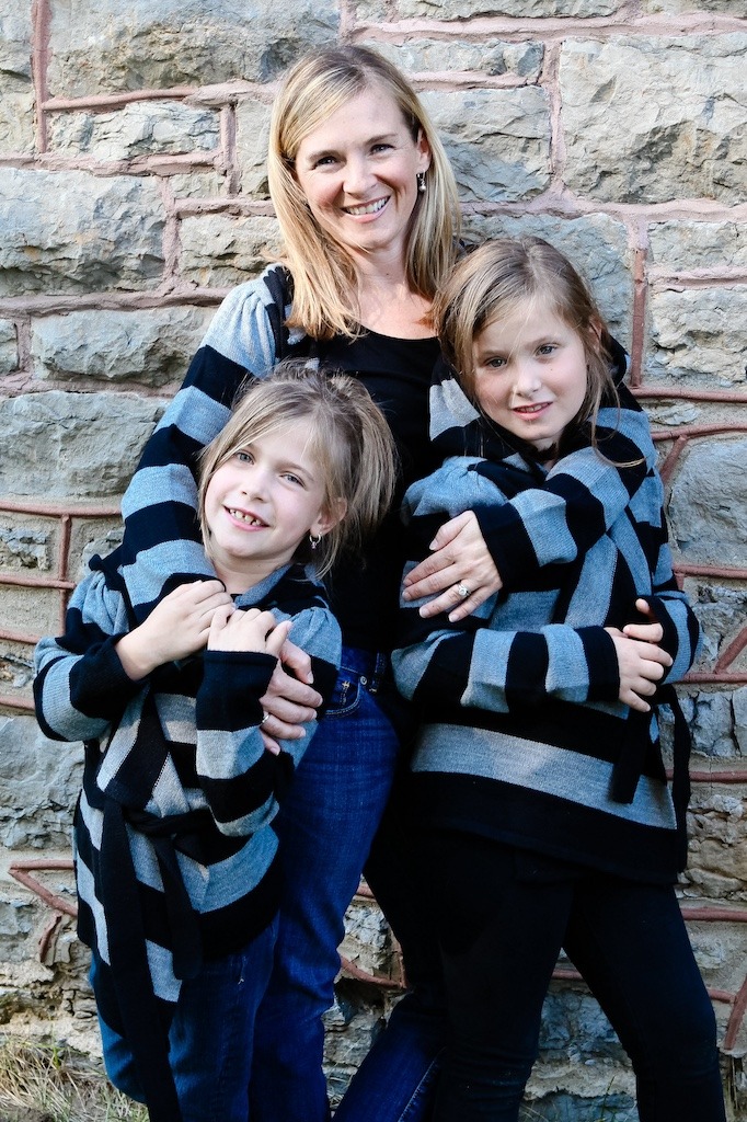 a woman with her two daughters, the year she had a hysterectomy. Women's health research